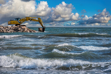 Fototapeta premium Construction of breakwater cliffs to defend the coastline from storms