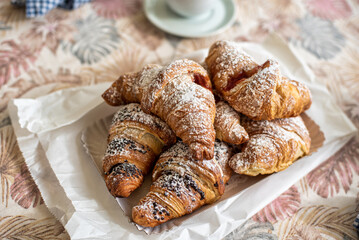tray of fresh brioche, filled with various jams and creams