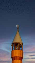  Vertical photo for Islamic days. Mosque minaret . Empty text space for stories, posts.