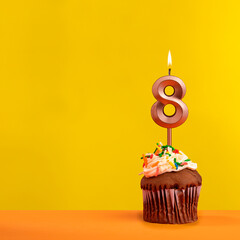 Candle with flame number 8 - Birthday card on yellow background