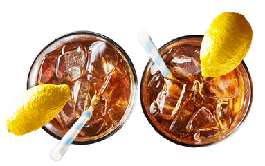 iced sweet tea with ice and paper straw with lemon wedge garnish on transparent background shot from overhead view  - 616227169