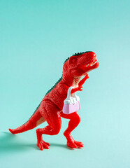 Cute red dinosaur with little pink purse on blue background.