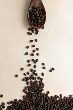 Beautiful image of roasted coffee beans with scoop and jute cover