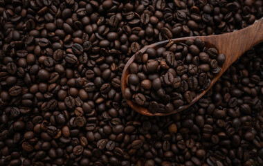 Coffee beans flat lay image with wooden scoop