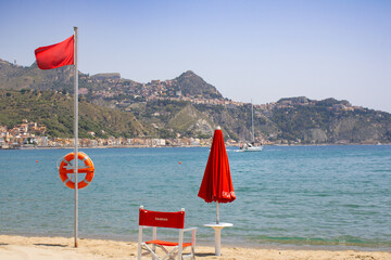 Lifeguard station at Naxos beach, Taormina in the background, Sicily