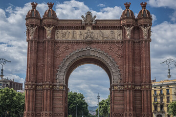 Fototapeta na wymiar Arc de Triomf triumphal arch on promenade of the Passeig de Lluis Companys in Barcelona, Spain