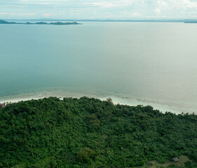 Aerial drone view of lush green island scenery with at Tinggi Island or Pulau Tinggi in Mersing, Johor, Malaysia