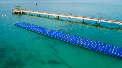 Drone shot of jetty scenery by the coast at Tinggi Island or Pulau Tinggi in Mersing, Johor, Malaysia