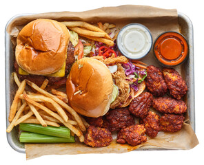 tray with burger, fried chicken sandwich, boneless wings, french fries, and sauce on transparent background shot from overhead view  - 616239550