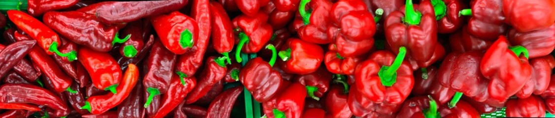 red and green peppers in the market. panoramic