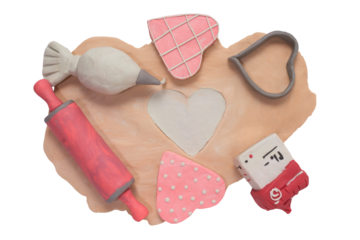 Baking ingredients and kitchen utensils handmade from plasticine for preparing heart shaped sugar cookies. Home made cookies and metal model