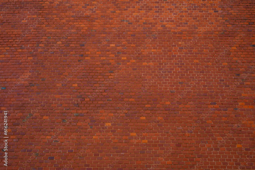 Sticker Big brick wall made of orange and red bricks as part of outer wall of Wawel castle in Krakow, poland. Frontal View