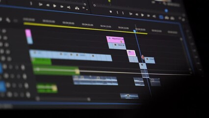 Work in the program for video editing on personal computer or laptop close up. Navigation in a computer program. Cursor movement. Work in the home office. - Powered by Adobe