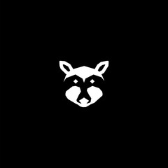Raccoon head icon isolated on black background 