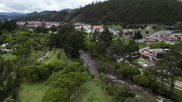 Aerial View of the city of Cuenca, Ecuador, with its many churches, rivers, and parks on a cloudy day