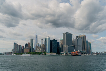 Fototapeta premium Lower Manhattan from the Hudson River on a Partly Cloudy Day