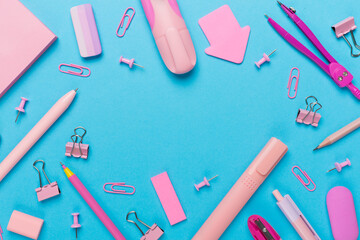 Pink school stationery on color backgroung, top view