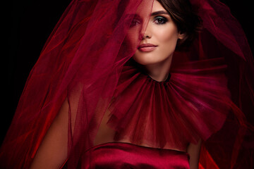 High fashion magazine closeup portrait of dark bride lady wear ruby dress lace veil posing tender...