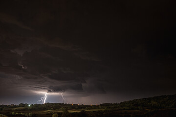 Storm clouds and lightning in the night sky