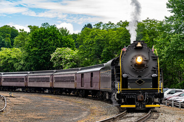 A View of A Restored Steam Passenger Train Approaching Around a Curve Traveling Thru Rural America...