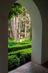 Looking through an archway into the Secret Garden in Spain