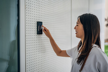 Woman with badge card near office door