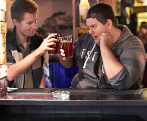 Friends, beer and cheers with man at pub for conversation, social and alcohol. Nightlife, toast and restaurant with people talking at table in bar for discussion, celebration and weekend gathering