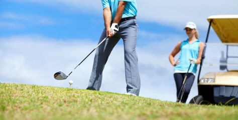 Low angle, man or golfer playing golf for fitness, workout or exercise to swing with driver on...