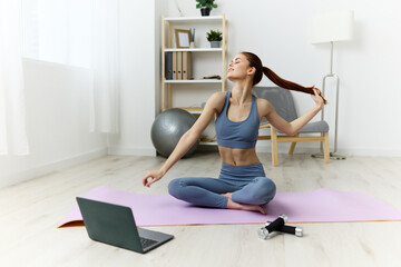 Fototapeta na wymiar lotus woman lifestyle video health room mat home yoga laptop training