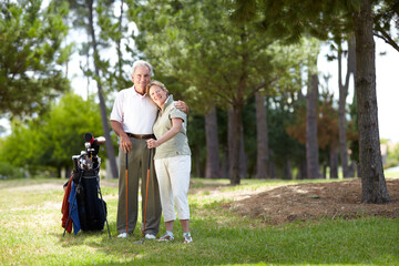 Fototapeta premium Portrait, smile or happy old couple on golf course in fitness workout, exercise or round together on grass. Embrace, healthy elderly man hugging or smiling in golfing sports game with senior woman