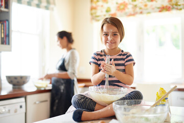 Portrait, flour or happy girl baking in kitchen with parent for bonding, child development or food...