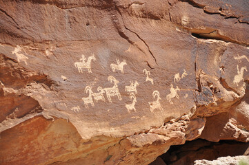 petroglyphs on a rock in the desert in Utah