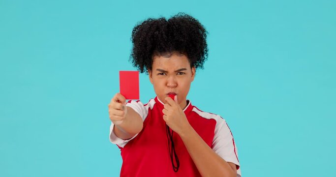 Whistle, red card and female referee in a studio with rules for a football match, game or tournament. Sports, fitness and portrait of a woman soccer coach with equipment isolated by a blue background