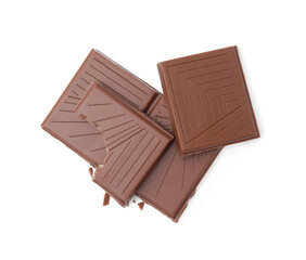 Broken milk chocolate bar on white background, top view