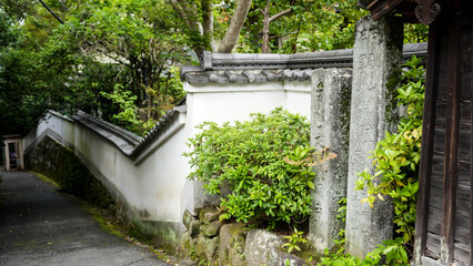 A stone monument located in front of the moat surrounding the shrine.
