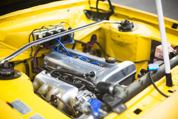 Yellow race car engine detail.