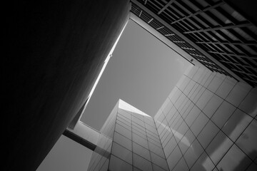 Black and white tone, low angle view of the courtyard between modern museum's facade against the...