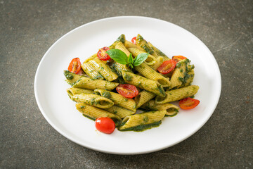 penne pasta with pesto sauce and tomatoes