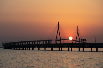 Obraz premium bridge and sunset over the sea 