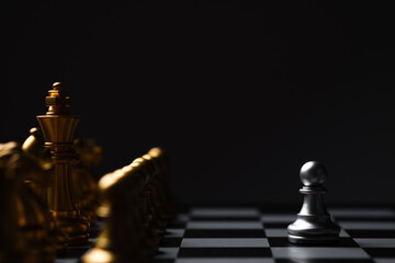 Chess Single pawn stand alone against many enemies as a symbol of difficult unequal fight or...