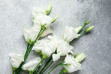 Beautiful eustoma flowers on black and white background, closeup