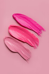Lipstick strokes on pink background