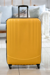 Yellow suitcase in living room
