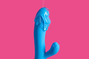 Vibrator with lubricant on pink background - obrazy, fototapety, plakaty
