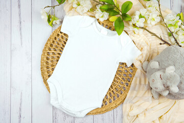 Baby romper bodysuit onesie gender neutral mockup. Modern farmhouse theme SVG craft product mockup on a white wood background.