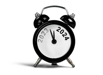 Black alarm clock on with number year. New year concept.