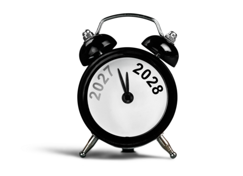 Black alarm clock on with number year. New year concept.