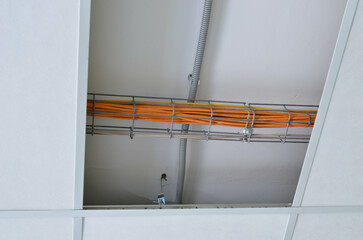 internet cables are laid over the suspended ceiling in the server room.