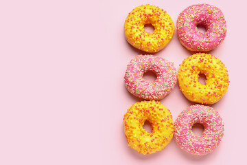 Sweet donuts on pink background