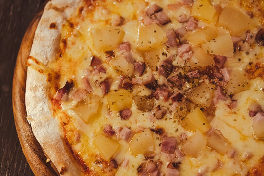 Close Up Of Tasty And Delicious Thin Hawaiian Pizza With Ham And Pineapple